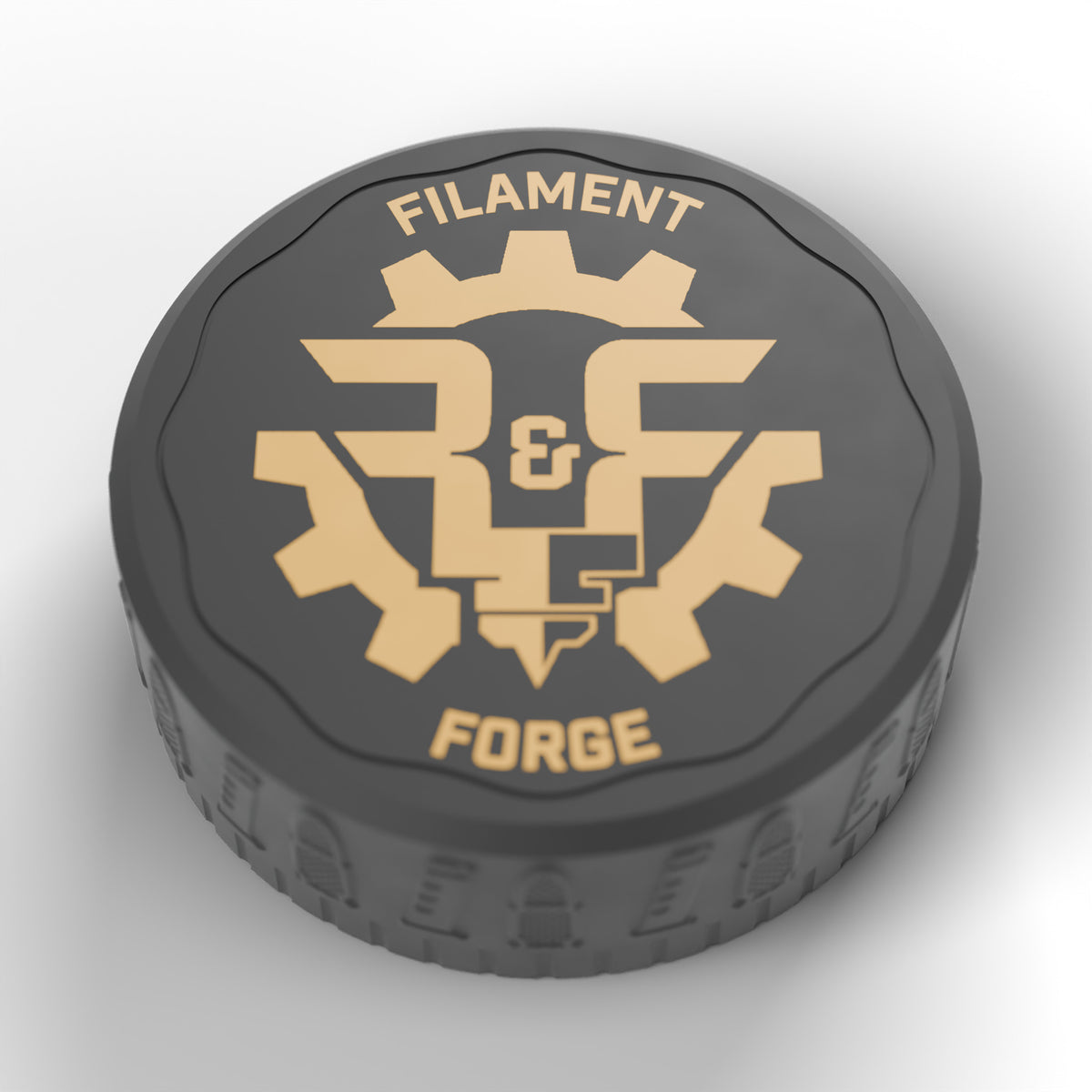 Gold Filament & Forge badge inlaid in the black lid of the F&F 50-round ammo puck