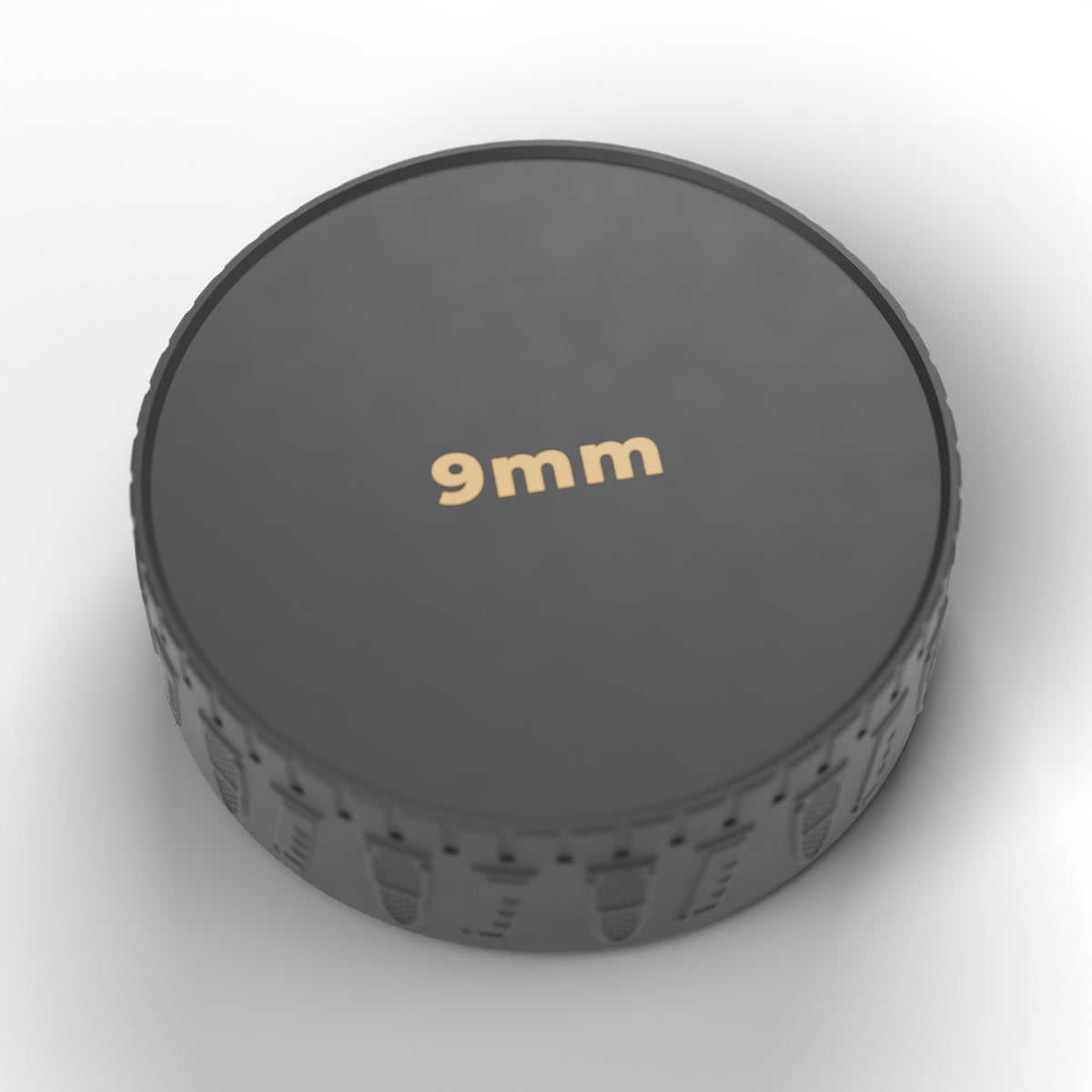 Underside of the F&F ammo puck with the caliber (9mm) marked in gold