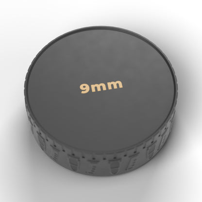 Underside of the F&F ammo puck with the caliber (9mm) marked in gold