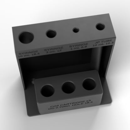 High view of the syringe, JP tube and CO2 block showing the labeled holes and cartridge cups