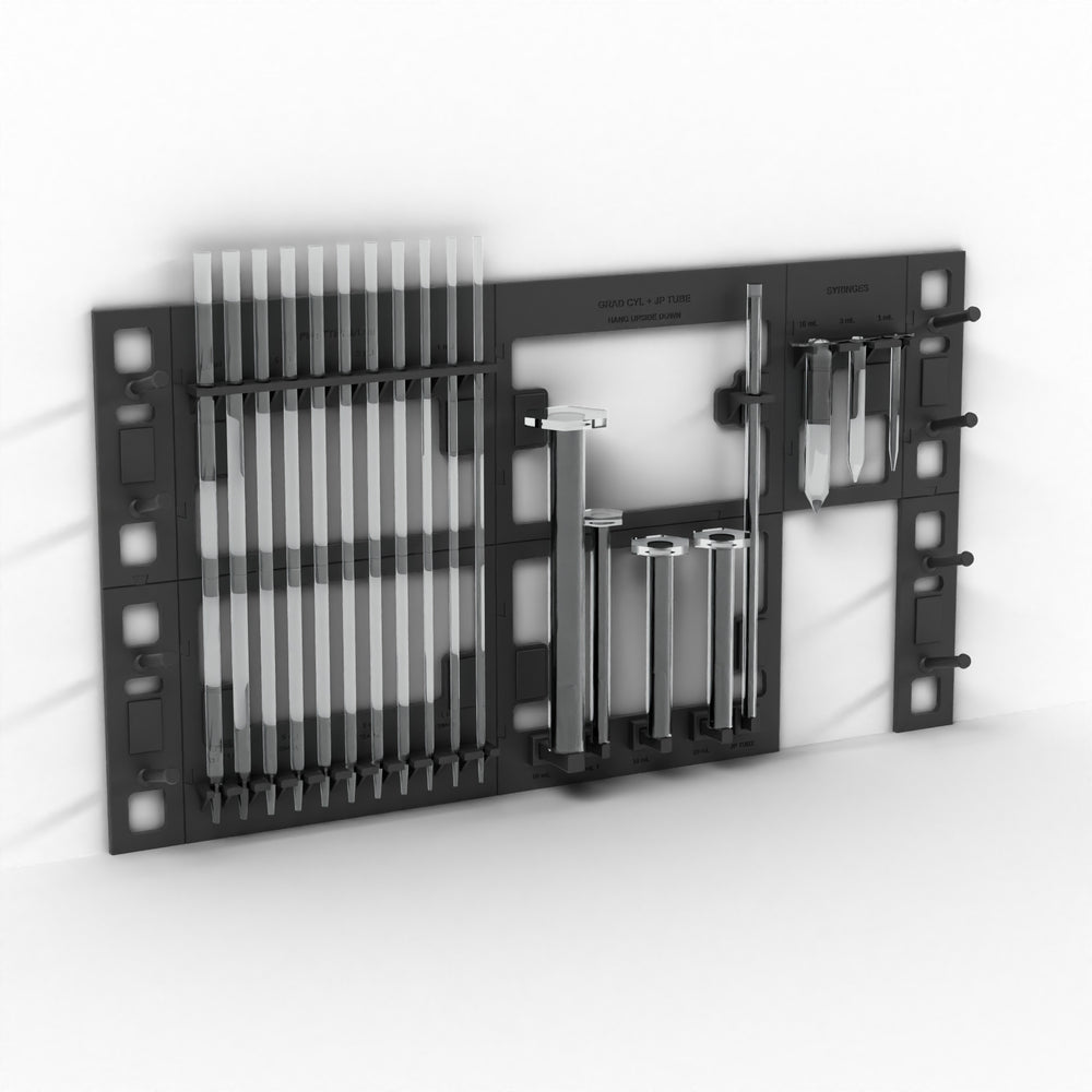 Black wall-mount lab rack holding pipettes, graduated cylinders, JP tube and syringes off the bench (glassware not included)