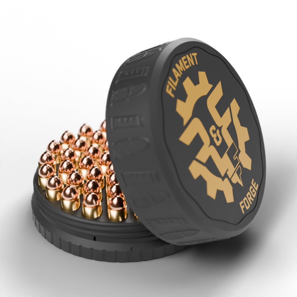 F&F 50-round ammo puck for 10mm Auto, open with 50 rounds and the gold-badge textured lid leaning beside it